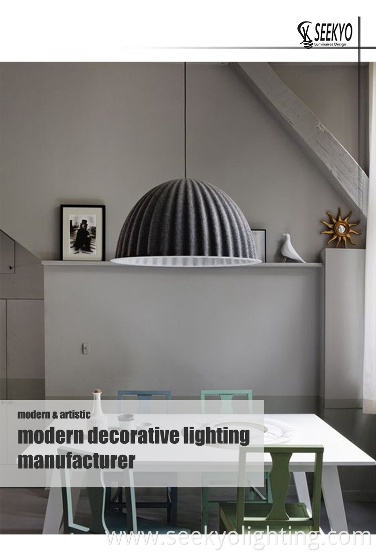 The hanging lamp is suspended from the ceiling by a sturdy metal rod or chain, providing a soft and diffused light that creates a warm and inviting ambiance.